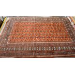 A Turkoman design red ground rug