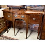 An inlaid mahogany crossbanded serpentine front sideboard