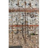 A trio of weathered steel arrow head garden obelisks,122 cm x 38 cm