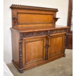 A Victorian foliate carved oak sideboard