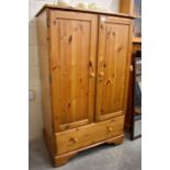 A stained pine children's wardrobe