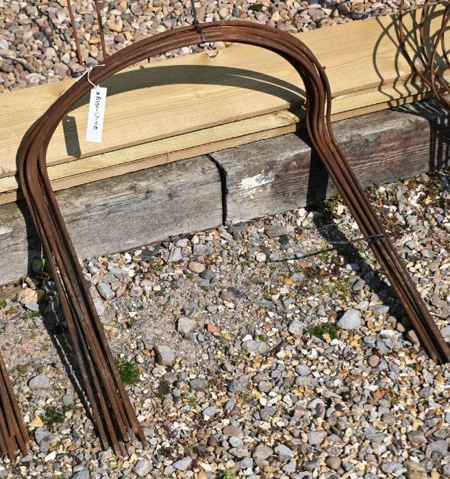 A bundle of ten medium curved weathered steel plant supports, 60 cm x 56 cm