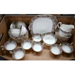 An Aynsley china tea service with decorative printed borders