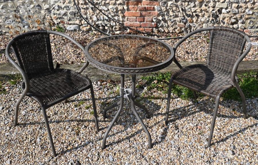 Rattan and glass terrace table and two chairs
