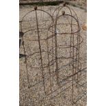 A trio of weathered steel ball head garden obelisks, 120 cm x 44 cm