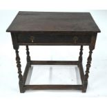 A 17th century oak side table with frieze drawer