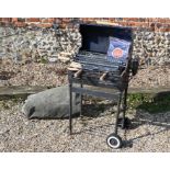 A Barbeskew II Hands Free BBQ (blue)