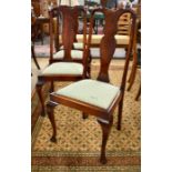 A set of four Queen Anne style vase back dining chairs
