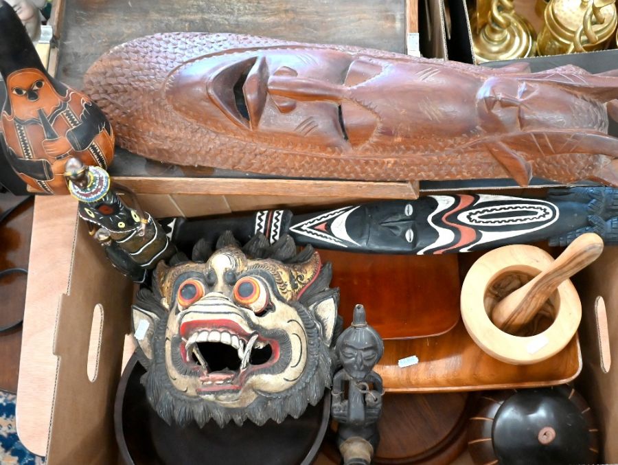 A collection of various carved wood tribal and other artefacts