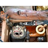 A collection of various carved wood tribal and other artefacts