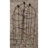 A trio of weathered steel ball head garden obelisks, 100 cm x 27 cm