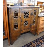 A provincial carved oak hall cupboard