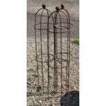 A trio of weathered steel ball head garden obelisks, 103 cm x 24 cm