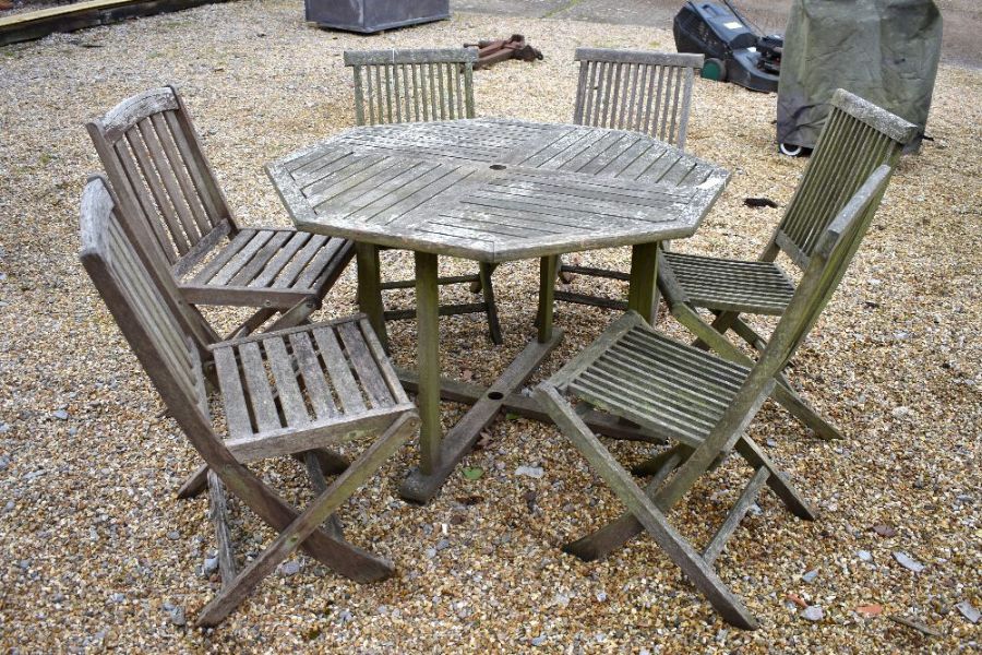 Weathered teak dining table and six chairs