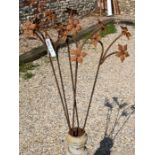 Five triple flower head weathered steel garden stakes, 147 cm