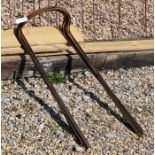 A bundle of ten tall curved weathered steel plant supports, 90 cm x 36 cm