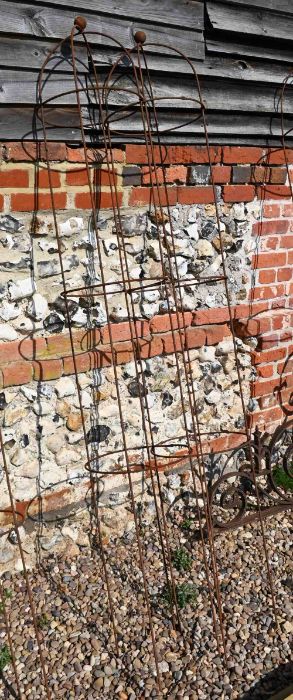 A pair of weathered steel ball head garden obelisks, 202 cm x 34 cm