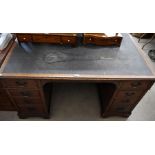 A mahogany twin pedestal desk