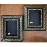 A pair of ebonised and brass inlaid decorative photograph frames