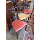 A trio of Victorian carved mahogany side chairs