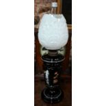 A Victorian opaque glass oil lamp