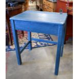 A vintage blue painted school desk