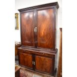 A George III mahogany two part library cabinet