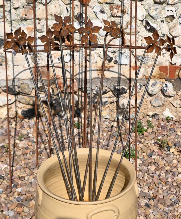 Ten floral cast weathered steel garden stakes, 85 cm