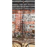 A pair of weathered steel ball head garden obelisks, 212 cm x 44 cm