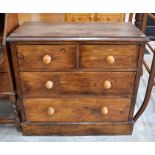 A small antique stained pine chest of drawers