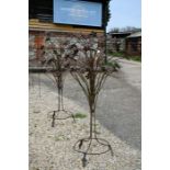A pair of large decorative floral garden stands