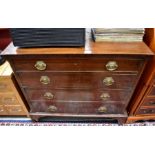 A 19th century mahogany chest of four long graduating drawers