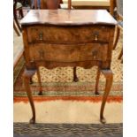 A Queen Anne style walnut two drawer side table