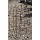 A trio of weathered steel arrow head garden obelisks, 124 cm x 41 cm