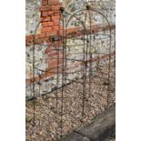 A pair of weathered steel ball head garden obelisks, 136 cm x 60 cm