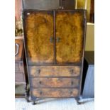 A 1950s walnut cabinet