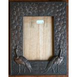 A decorative copper photograph frame