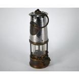 A vintage miner's lamp (maker's plate obscured)