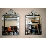 A pair of Venetian style etched glass wall mirrors