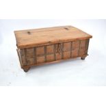 An antique Indian hardwood and metal bound dowry chest