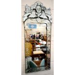 A Venetian style etched glass wall mirror