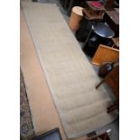A contemporary Crucial Trading woven carpet runner