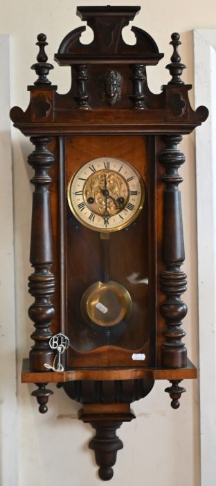 A walnut cased Vienna style wall clock