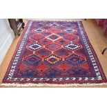 A Persian red ground rug