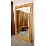 A large modern bevelled wall mirror