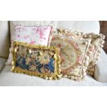 A trio of old Aubusson faced cushions to/with another