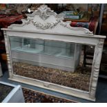 A large French white distress painted over-mantel