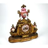 A 19th century French ormolu and pictorial pink porcelain mounted eight-day two train mantel clock