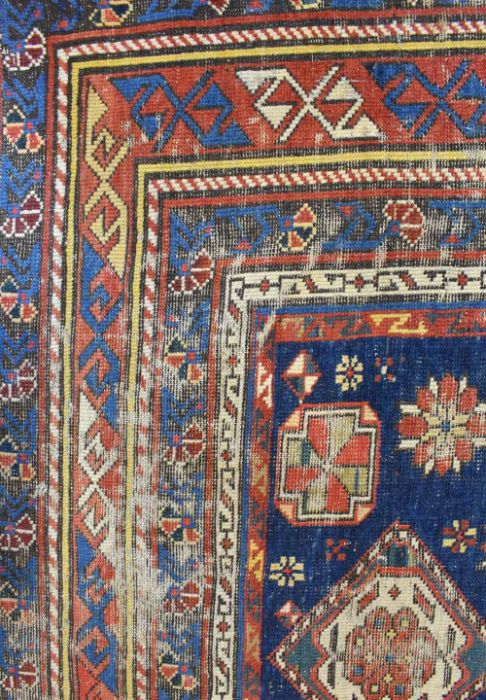 A blue ground Caucasion kazak design rug (heavily worn) - Image 3 of 7