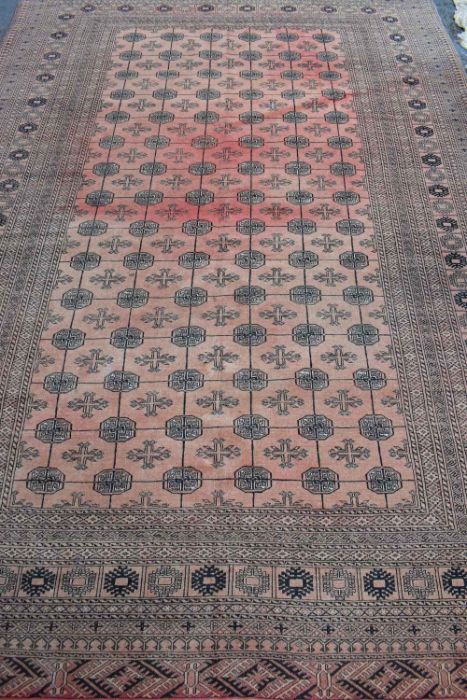 A red ground washed Afghan carpet - Image 2 of 3